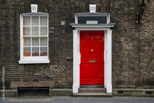 Canvas Print Red house door on a London street. Red residential front door