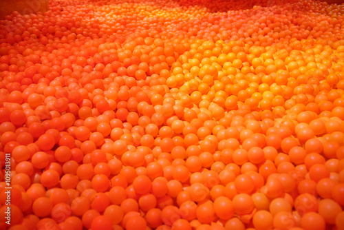 Huge ball pit with orange plastic balls