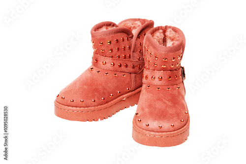 Winter boots for children. Close-up of a pair of elegant brown suede winter boots which are lined with fur. Girls winter shoe fashion isolated on a white background.