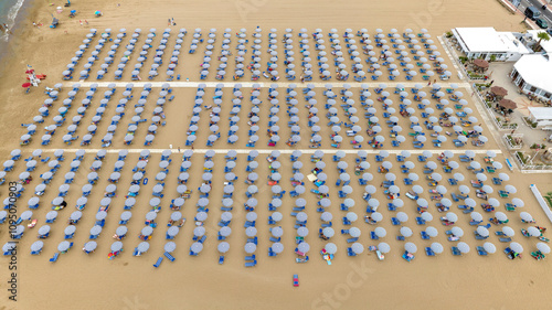 Bilde på lerret Aerial view of a lido on a large and crowded sandy beach