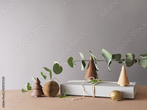 Creative still life with holiday decorations and gifts. Neutral background, copy space