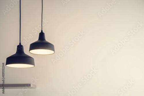 Modern minimalist black hanging lamps in the interior of a home or office, close-up. Copy space, free space for text
