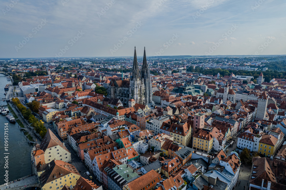 Fototapeta premium Beautiful aerial view of Regenesburg, its massive gothic St Peter cathedral, the Danube river and the Old Stone Bridge