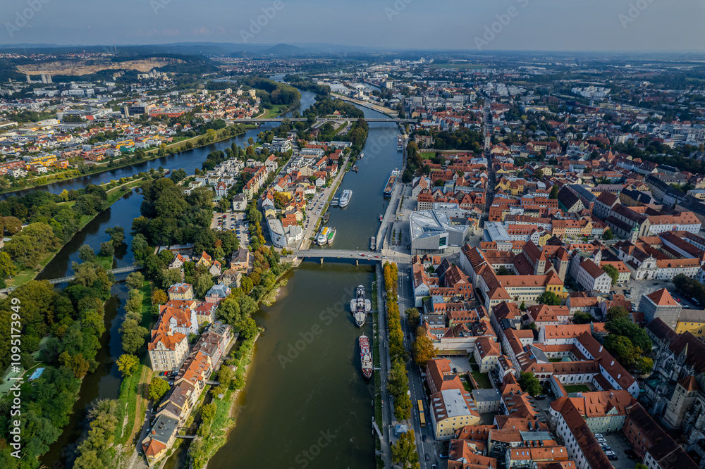 Obraz premium Beautiful aerial view of Regenesburg, its massive gothic St Peter cathedral, the Danube river and the Old Stone Bridge
