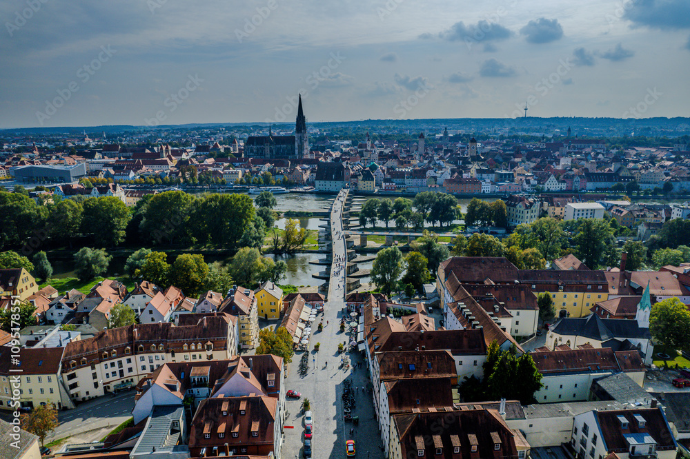 Obraz premium Beautiful aerial view of Regenesburg, its massive gothic St Peter cathedral, the Danube river and the Old Stone Bridge