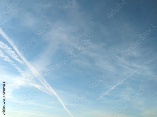 Blue Skys With Aeroplane condensation trails Contails in White Smoke for Background