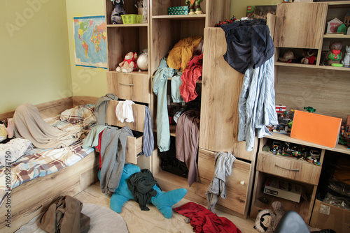 Scattered Things in Wardrobe, Disorder in Clothes. Childrens room is littered with clutter, clothes and things are scattered, Organizing Cleanliness