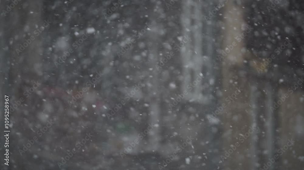 Heavy snowfall blankets the city during a cold winter day bringing a magical winter wonderland to life Heavy snowfall blankets the city during a cold winter day bringing a magical winter wonderland to life