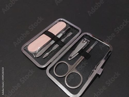 manicure set personal care nail file scissors isolated on black