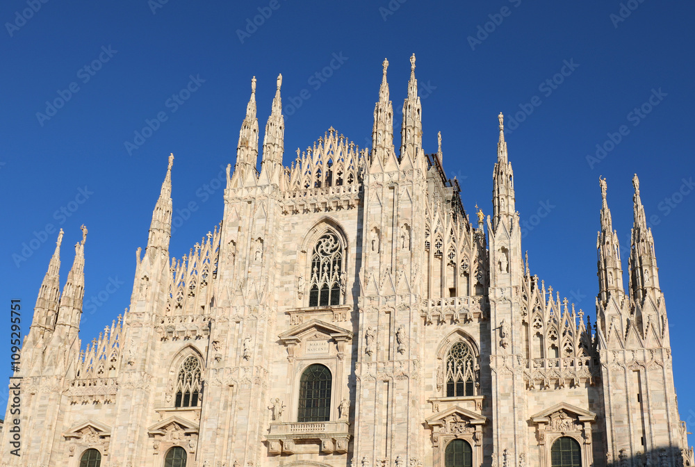 bottom view of Facade of Cathedral of Milan also called DUOMO DI MILANO in italian language in gothic style with sky bottom view of Facade of Cathedral of Milan also called DUOMO DI MILANO in italian language in gothic style with sky