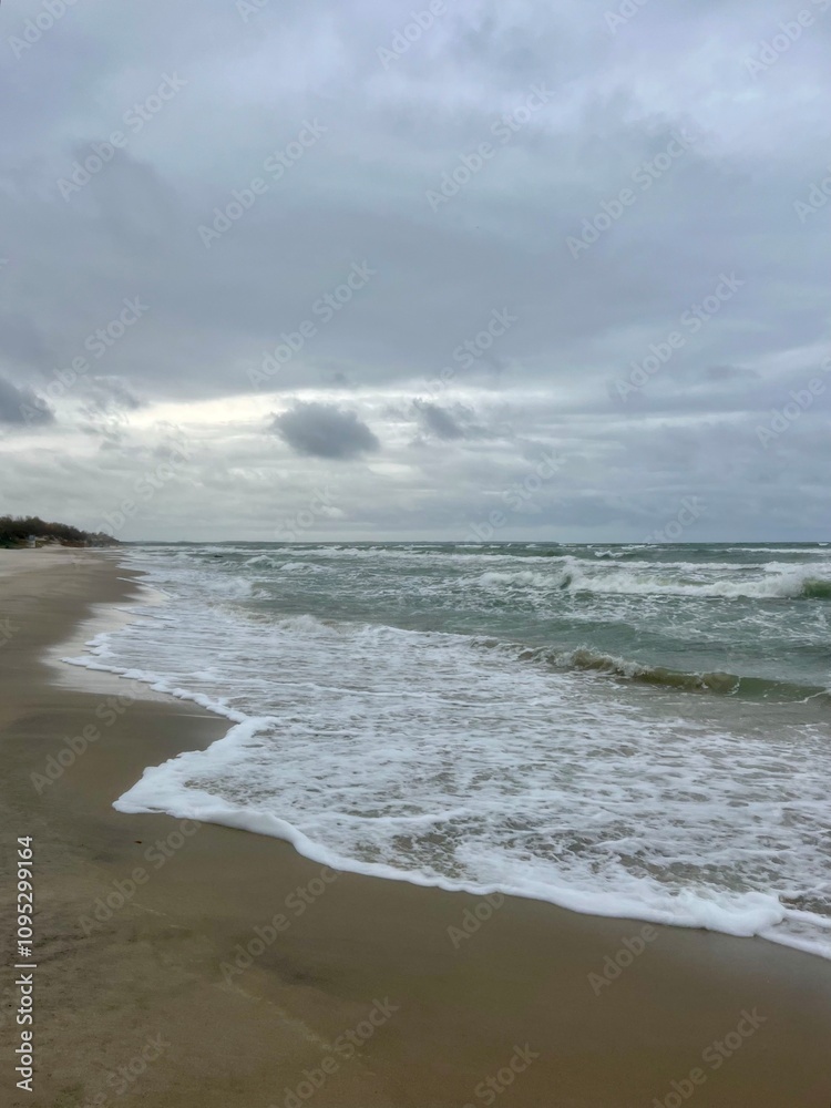 cloudy seascape, sandy shore, empty wild beach, clouds and waves cloudy seascape, sandy shore, empty wild beach, clouds and waves