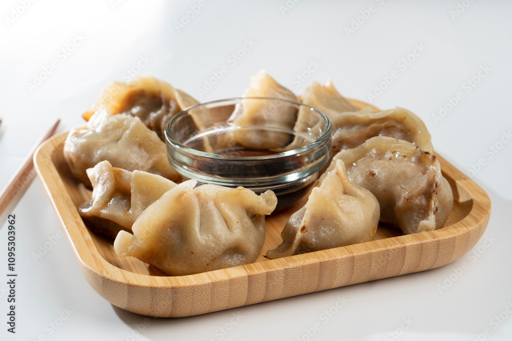 Dumplings with meat on a white background. Chinese dumplings are a traditional dish for Chinese New Year. Food concept. Chinese food. Dumplings with meat on a white background. Chinese dumplings are a traditional dish for Chinese New Year. Food concept. Chinese food.