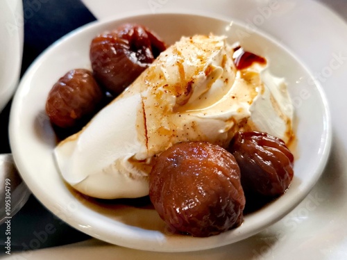 Delicious dessert of figs in syrup with clotted cream