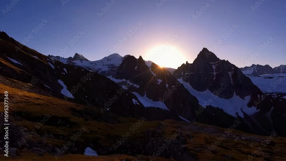 Sunrise casting golden light over majestic mountain peaks, illuminating the landscape with vibrant colors, creating a peaceful morning atmosphere. Sunrise casting golden light over majestic mountain peaks, illuminating the landscape with vibrant colors, creating a peaceful morning atmosphere.