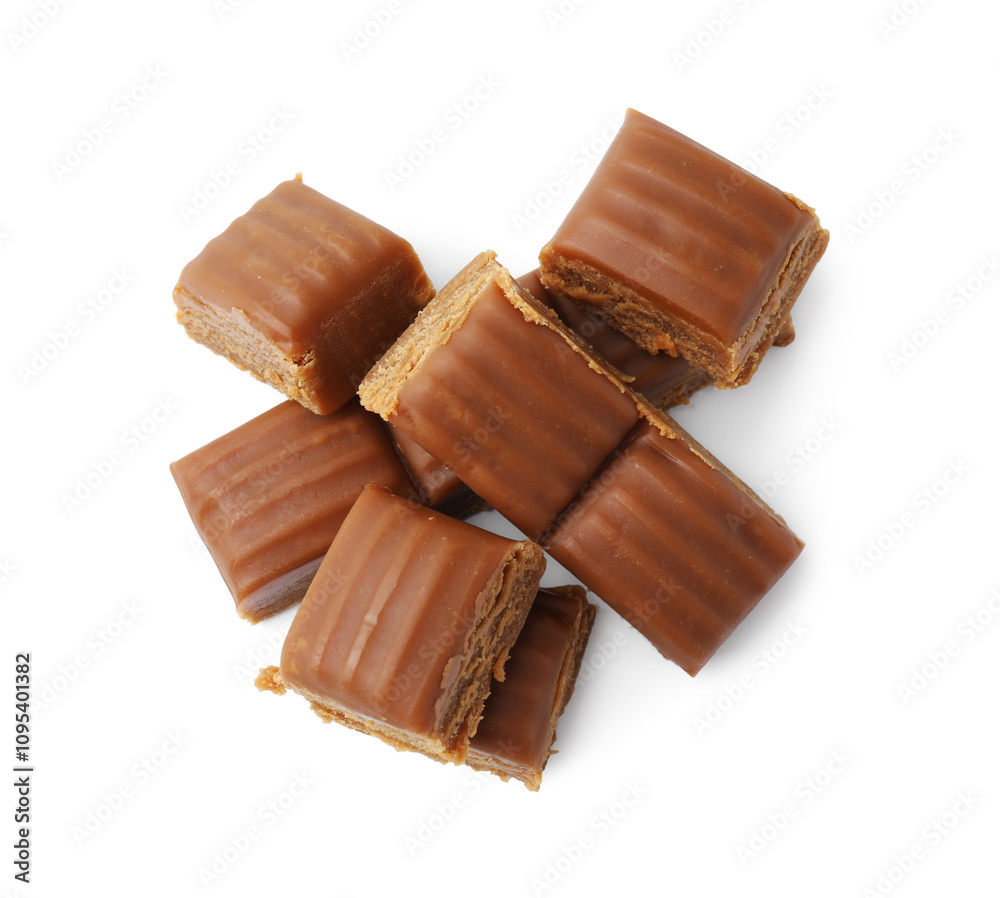 Tasty sweet caramel candies isolated on white, top view Tasty sweet caramel candies isolated on white, top view