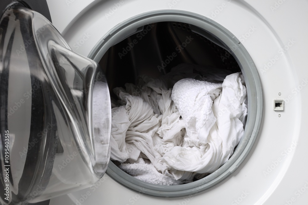 Open washing machine with clean clothes, closeup Open washing machine with clean clothes, closeup
