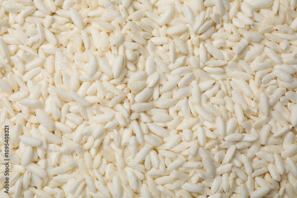 Wholegrain puffed rice as background, closeup view Wholegrain puffed rice as background, closeup view