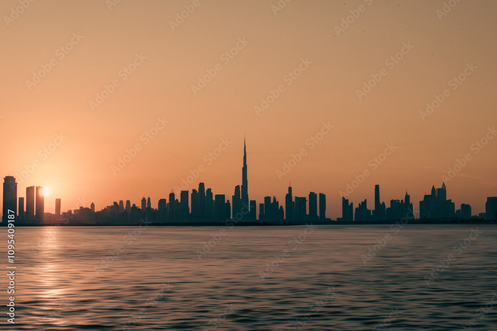 Stunning view of Dubai skyline with warm Pastel Sunrise colors, Beautiful, golden sunset view of the modern skyline at Dubai Stunning view of Dubai skyline with warm Pastel Sunrise colors, Beautiful, golden sunset view of the modern skyline at Dubai