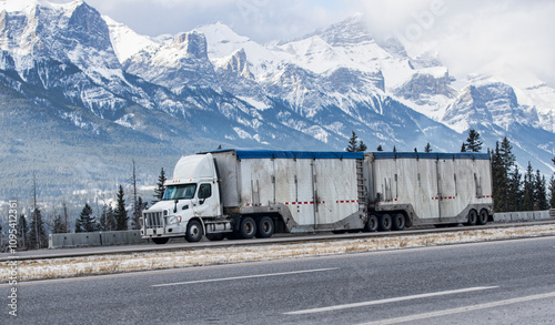 Heavy Cargo on the Road. A truck hauling freight along a highway. Taken in Alberta, Canada