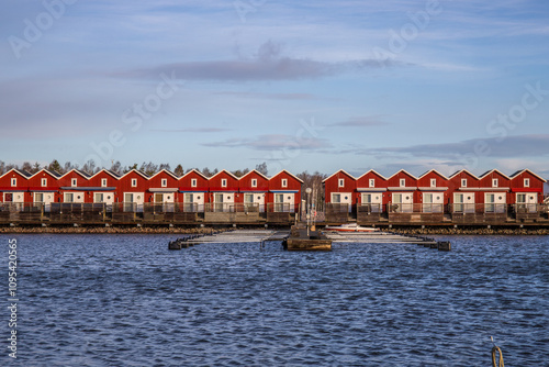 Harbor by the lake, landscape shot in autumn. Holiday village and harbor on the water in Sunnana Hamn in Sweden photo