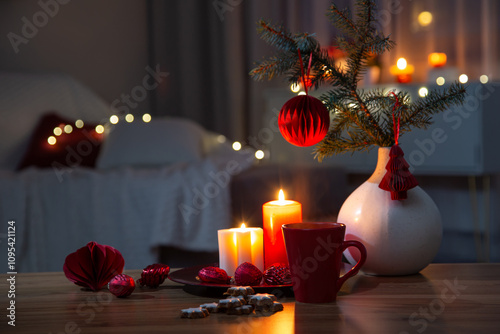 hot drink in red cup with christmas decorations at home