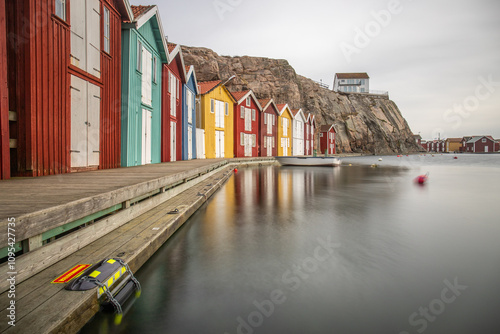 Small colorful houses by the sea. Typical houses in Sweden for the coastal landscape. Crab fishing and camp in a narrow harbor. Smögen, Smögenbryggan, Sweden photo