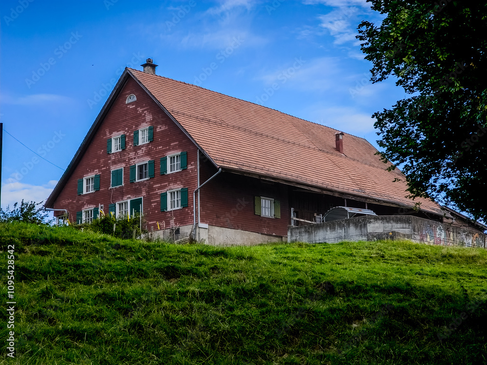 Intimate Perspective of Grass Fields Leading to a swiss Ranch in St. Gallen Intimate Perspective of Grass Fields Leading to a swiss Ranch in St. Gallen