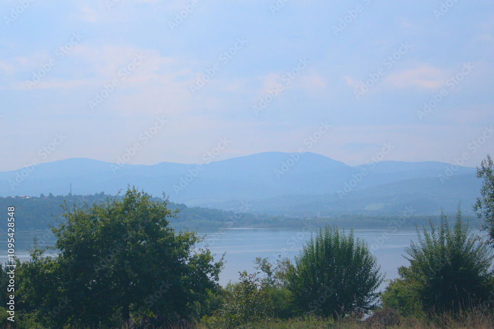 Breathtaking view of majestic mountains under a beautiful sky, where dramatic peaks meet the vibrant hues of the horizon Breathtaking view of majestic mountains under a beautiful sky, where dramatic peaks meet the vibrant hues of the horizon