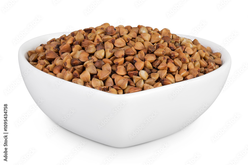 Raw buckwheat in ceramic bowl isolated on white background Raw buckwheat in ceramic bowl isolated on white background