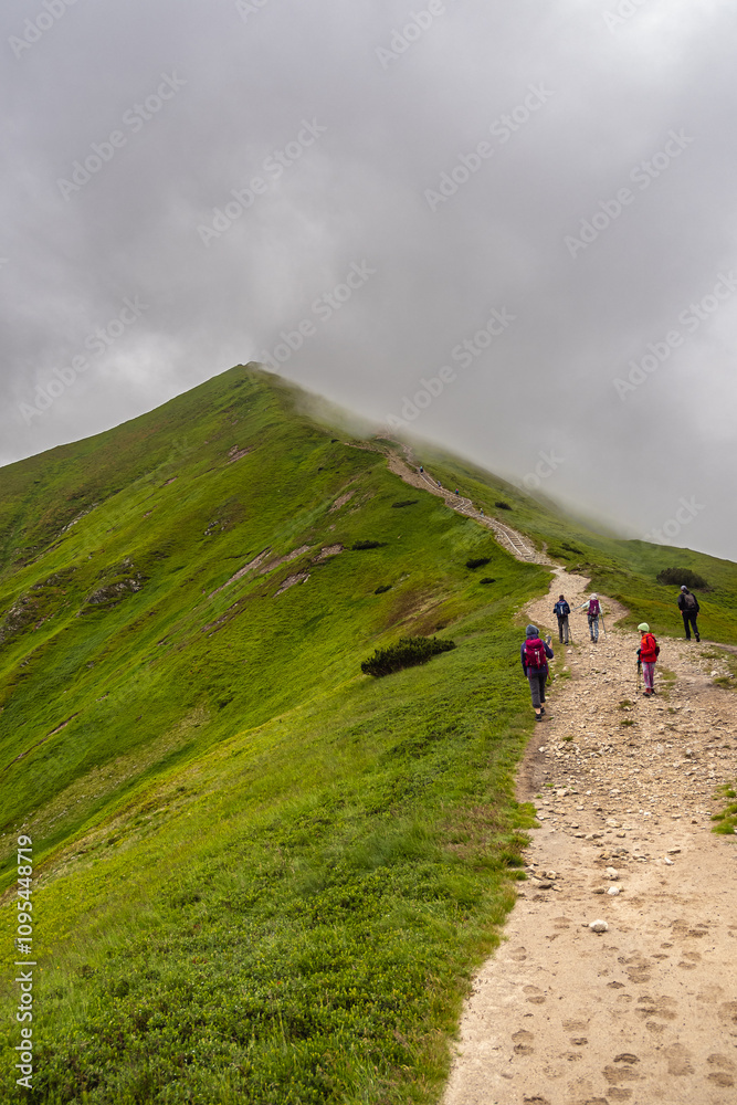 hiking in the mountains, on the trail to Rakoń a peak in the Polish Western Tatras