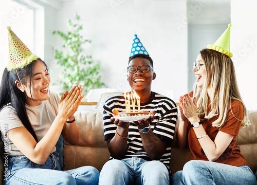 Wall Mural birthday celebration party cake happy candle blowing friendship fun friend woman