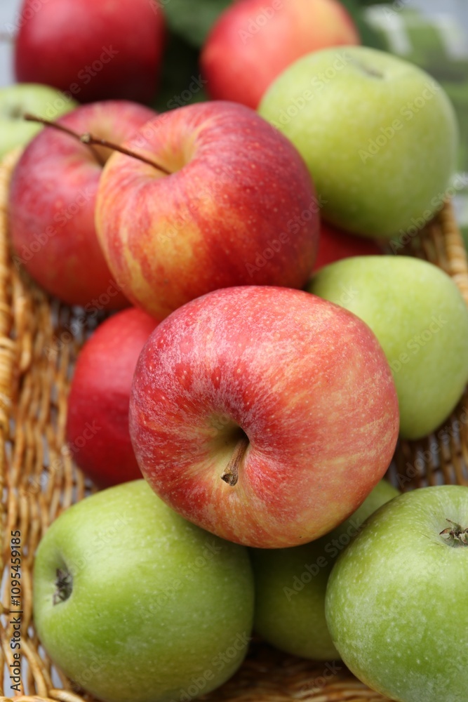 Fresh ripe apples in wicker basket, closeup Fresh ripe apples in wicker basket, closeup