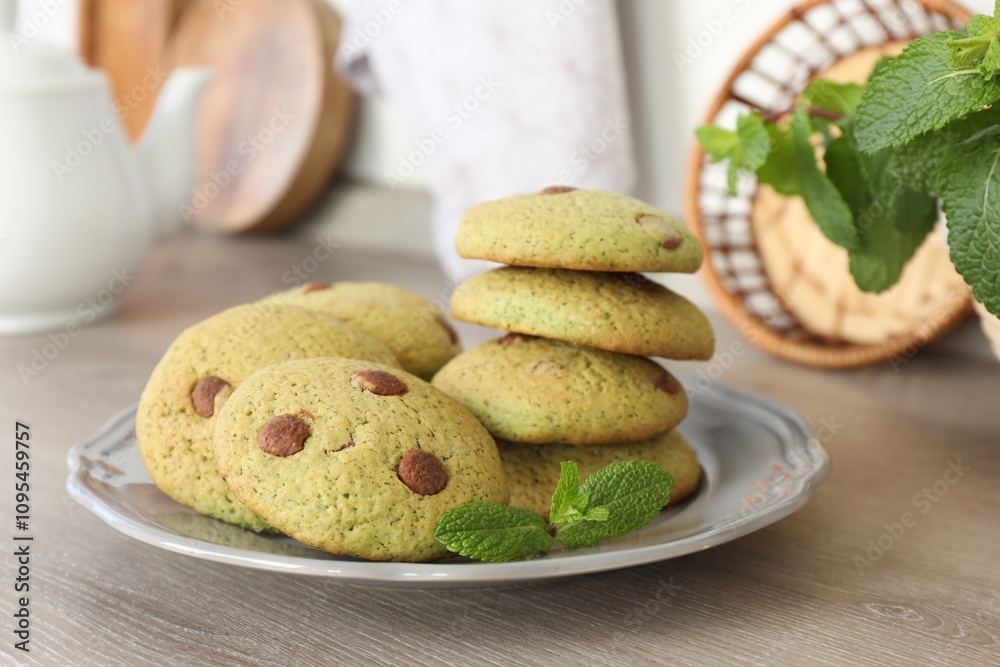 Delicious mint chocolate chip cookies on wooden table Delicious mint chocolate chip cookies on wooden table