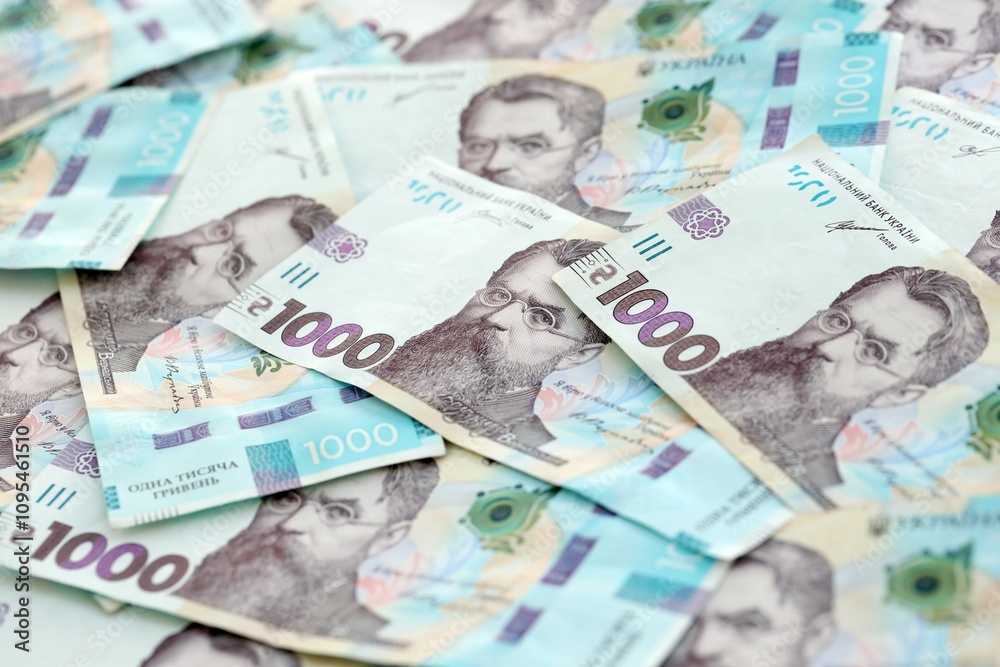 Big amount of ukrainian new one hundred hryvnia money bills with modern design. Financial concept, business Big amount of ukrainian new one hundred hryvnia money bills with modern design. Financial concept, business