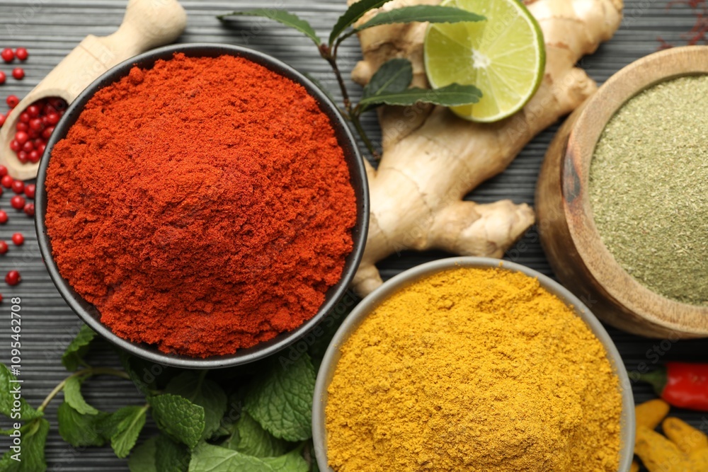Different aromatic spices and herbs on black background, flat lay Different aromatic spices and herbs on black background, flat lay