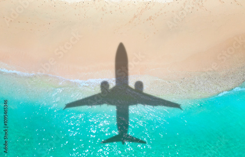 Airplane shadow flying over beautiful exotic tropical beach with sunny cay - Summer vacation travel concept . A happy family on summer holidays . Travel traveling vacation sea symbolic picture
 photo