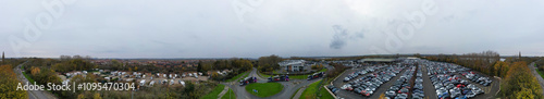 Aerial Panoramic View of Car Auctions Massive Car Parking Lot at Kempston Village of Bedford England United Kingdom. High Angle Footage Captured During Cloudy Evening on November 18th, 2024 photo