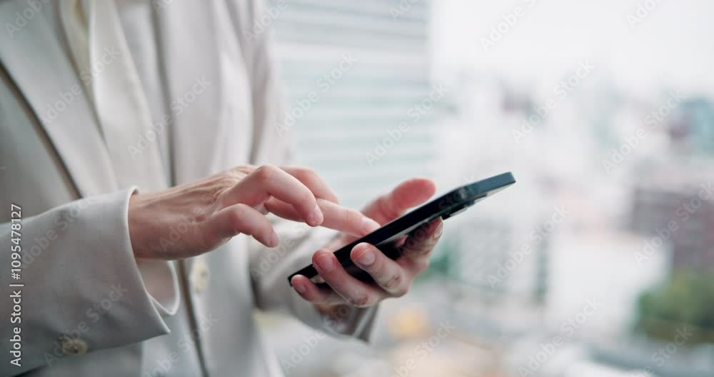 Woman, hands and phone at window for business, update schedule and planning in office. Trader, mobile or typing in Japanese agency for stock market research, investment opportunity or online feedback