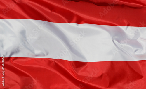 Close-up of the national flag of Austria, fluttering in the wind with folds, wave pattern