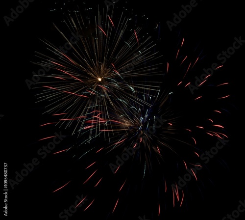 Colorful specks of light bursting in night sky photo