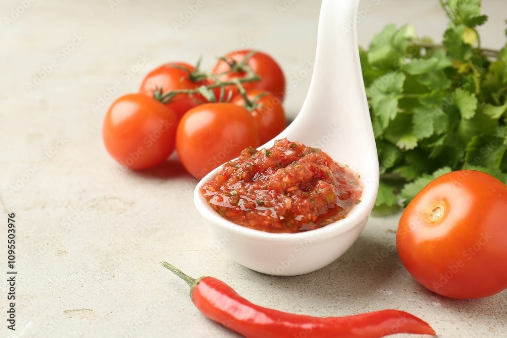 Delicious salsa sauce and products on light textured table, closeup Delicious salsa sauce and products on light textured table, closeup