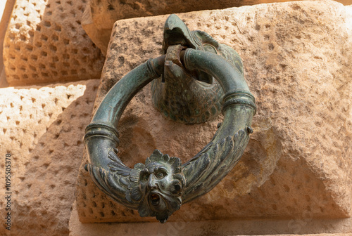 Decoration ring on the wall of Palacio de Carlos V in La Alhambra, Granada, Spain.