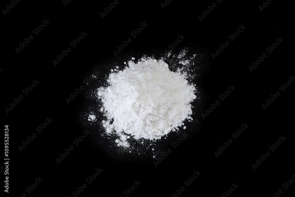 Pile of flour on black background Pile of flour on black background