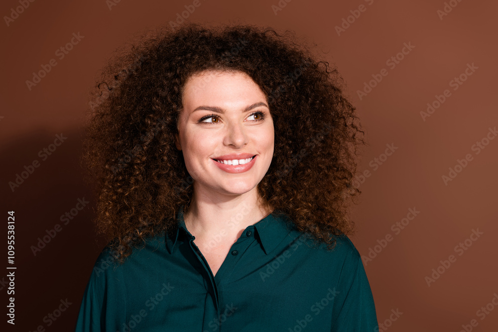 Photo of shiny attractive lady dressed formal shirt smiling looking empty space isolated brown color background