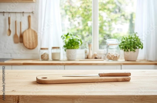 Minimalist Kitchen with Light Wooden Countertop and Cutting Board photo