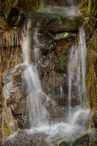 A small man-made waterfall in detail.
