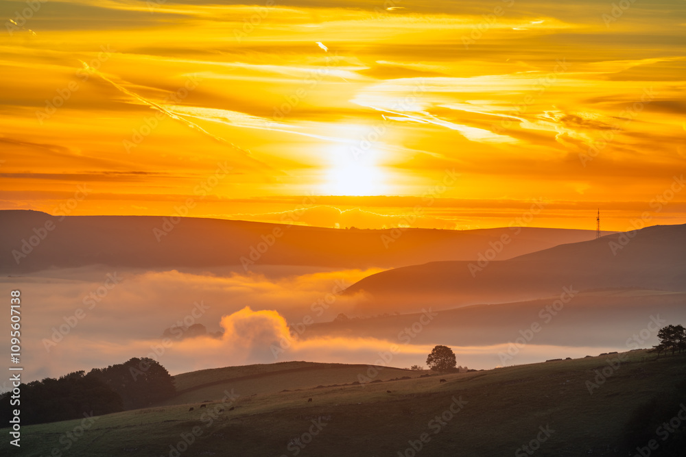 Puffy clouds in Hope valley at sunrise. Peak District. England