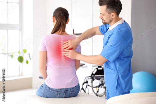 Male physiotherapist workin...