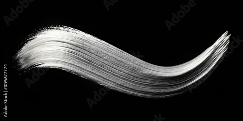 Abstract silver paint stroke on black background, elegant design element for various applications