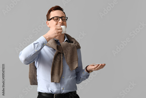 Young man in eyeglasses dri...